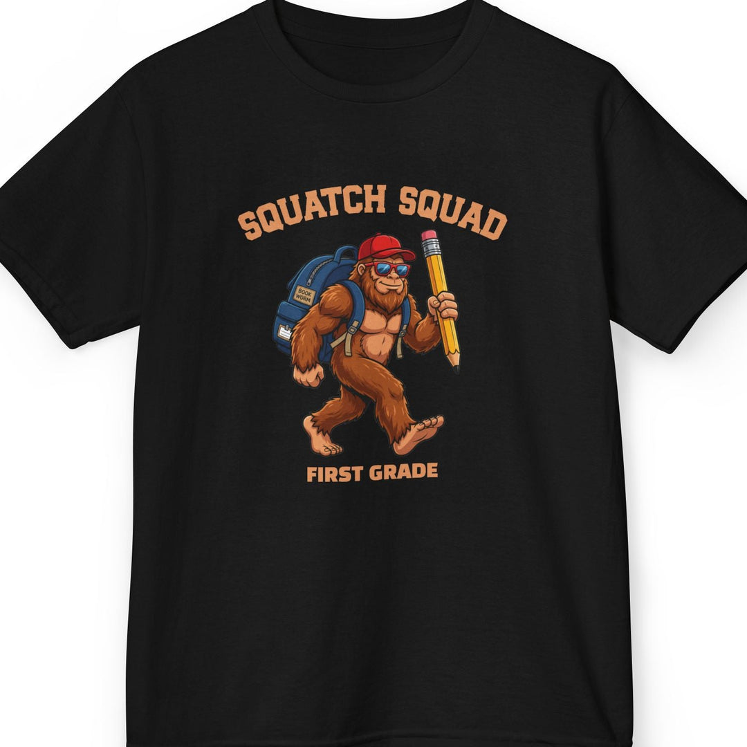 Black t-shirt with 'Squatch Squad' collegiate text in an arc on top of a bigfoot cartoon character wearing a blue backpack, red hat, and holding a giant pencil. Bottom line of text is personalizable. This one says 'first grade'