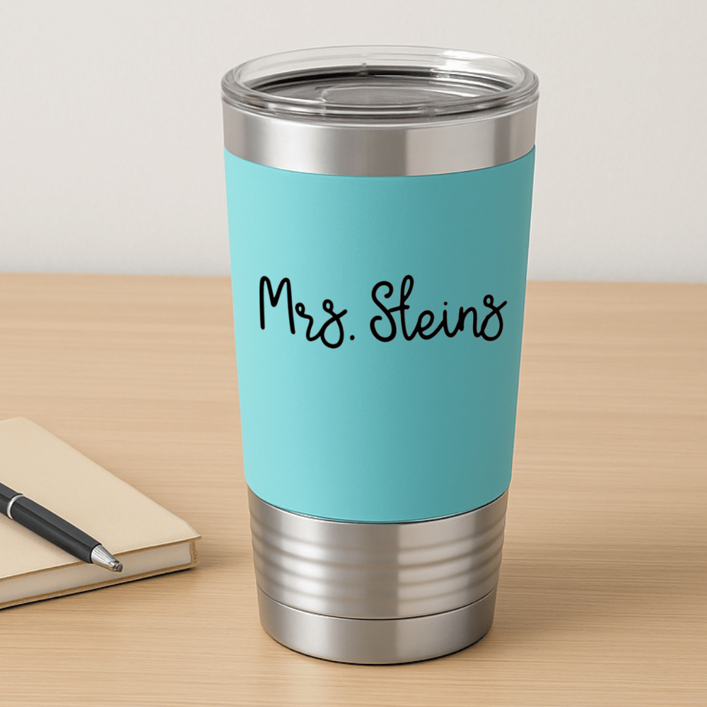 teal teacher tumbler sitting on a desk with 'Mrs. Steins' engraved in black