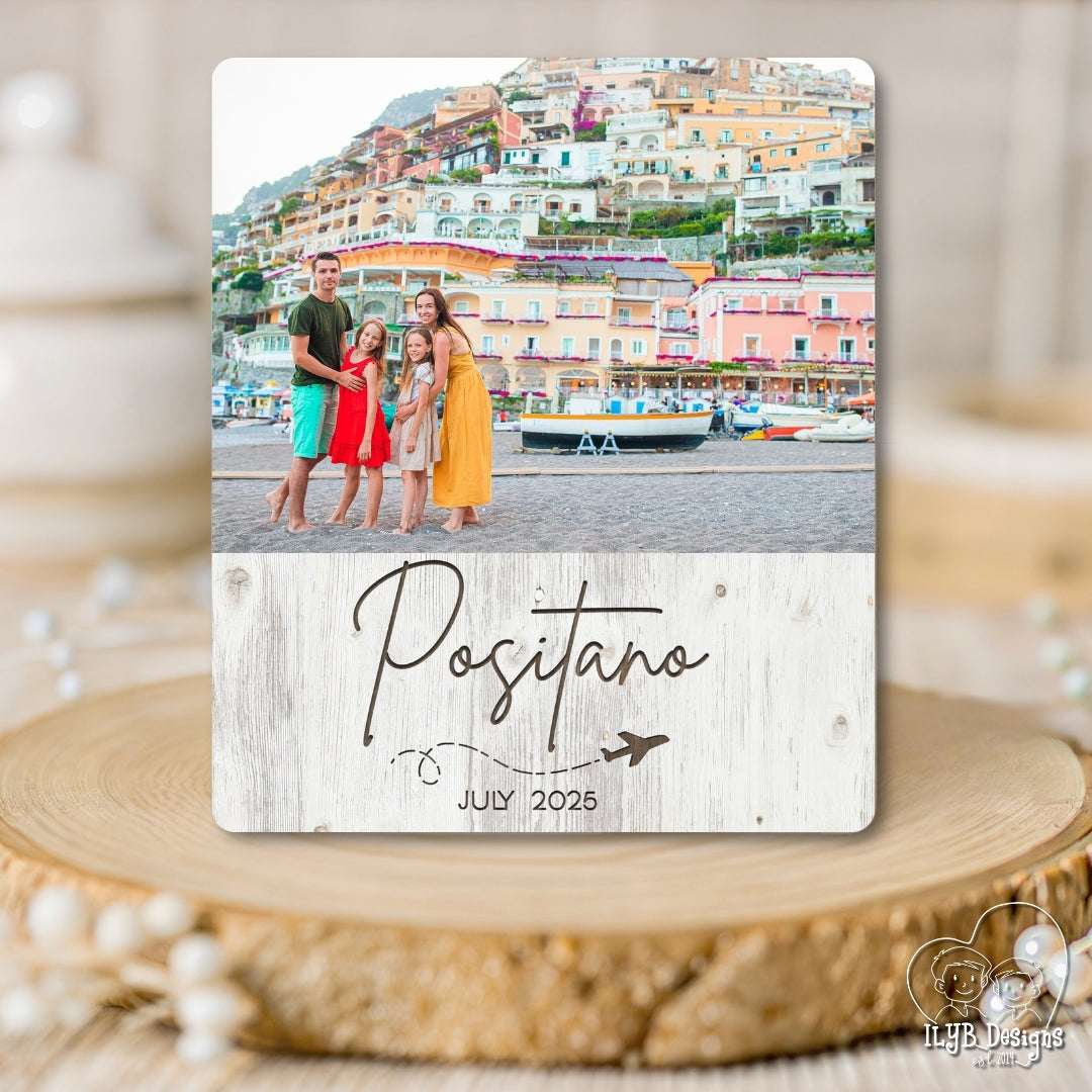 Photo plaque with a photo of a family in Positano, Italy, on a wooden surface.