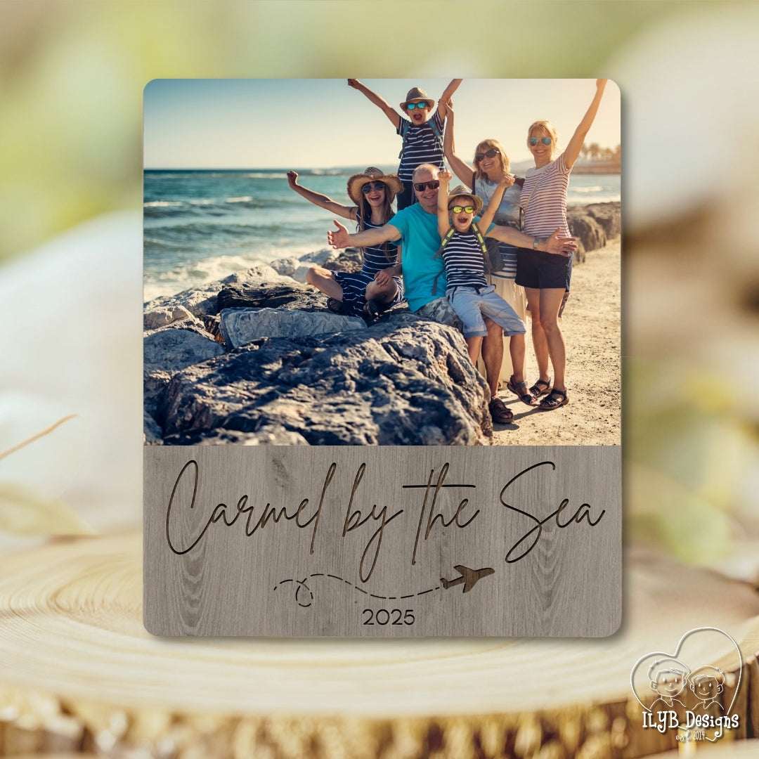 Family photo on a beach with 'Carmel by the Sea 2025' text overlay