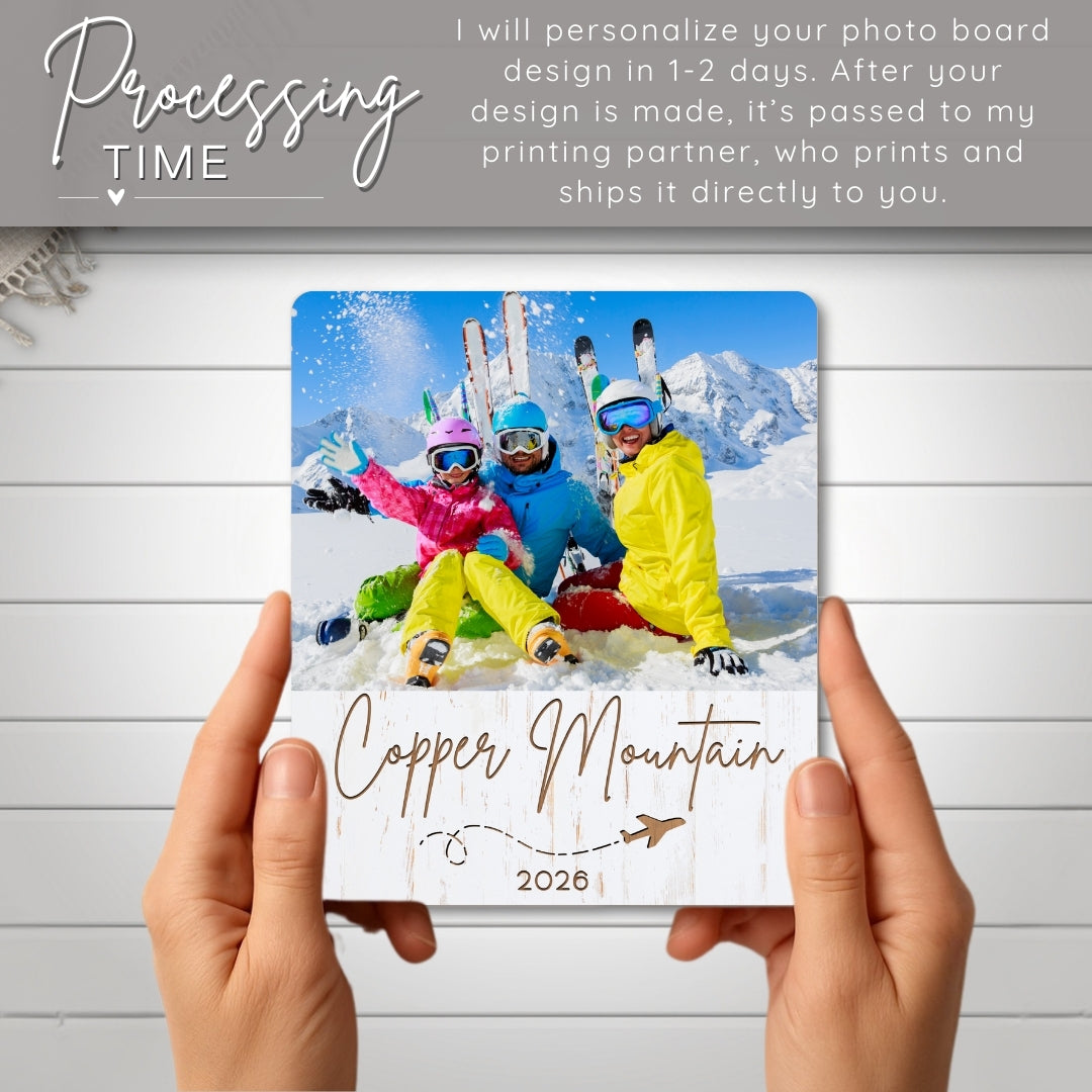 Personalized photo board with skiers at Copper Mountain 2020 held by hands on a wooden surface.