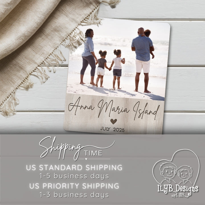Photo board plaque with family photo and text 'Anna Maria Island, July 2025' on a wooden surface with a blanket.