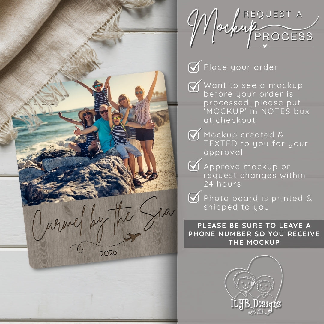 Wooden photo board with family photo and 'Carmel by the Sea 2025' text, placed on a wooden surface with a blanket.