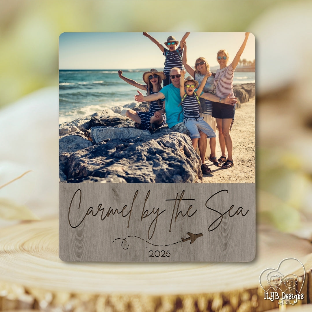 Family photo on a beach with 'Carmel by the Sea 2025' text overlay