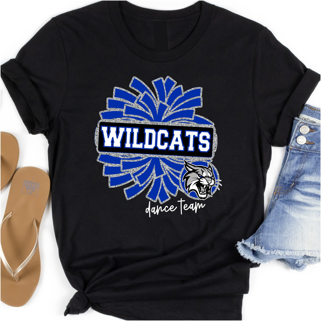 Black t-shirt with blue and glitter silver dance pom pom with 'Wildcats' text in the middle of the pom pom and a wildcat mascot head in the bottom right corner. Under design it says 'dance team' in white script font.