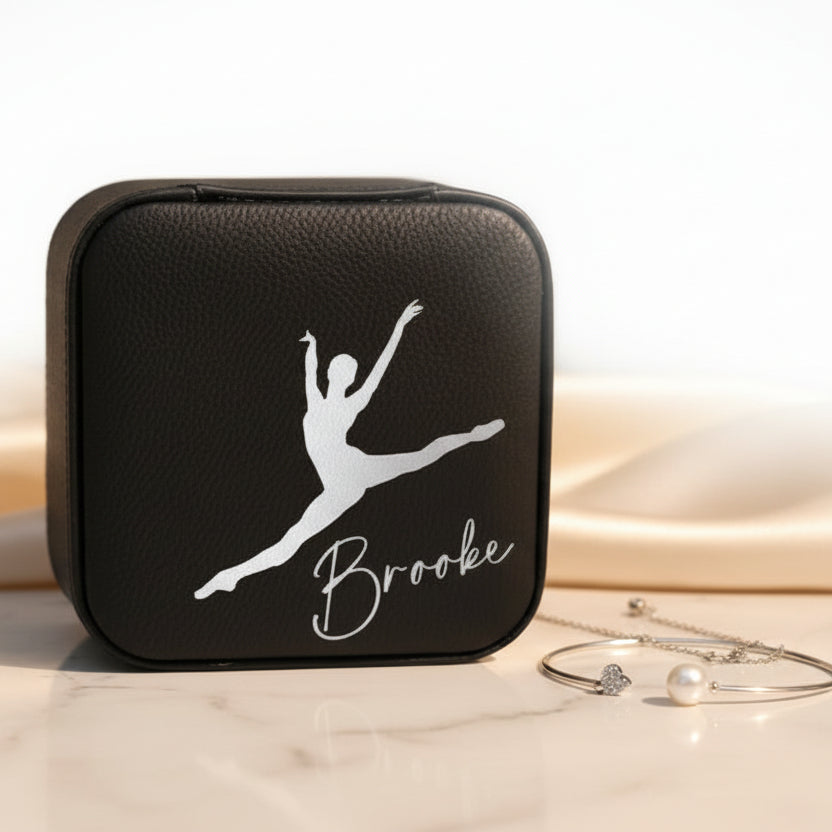 Black jewelry case with a metallic silver dancer illustration and 'Brooke' text engraved on it