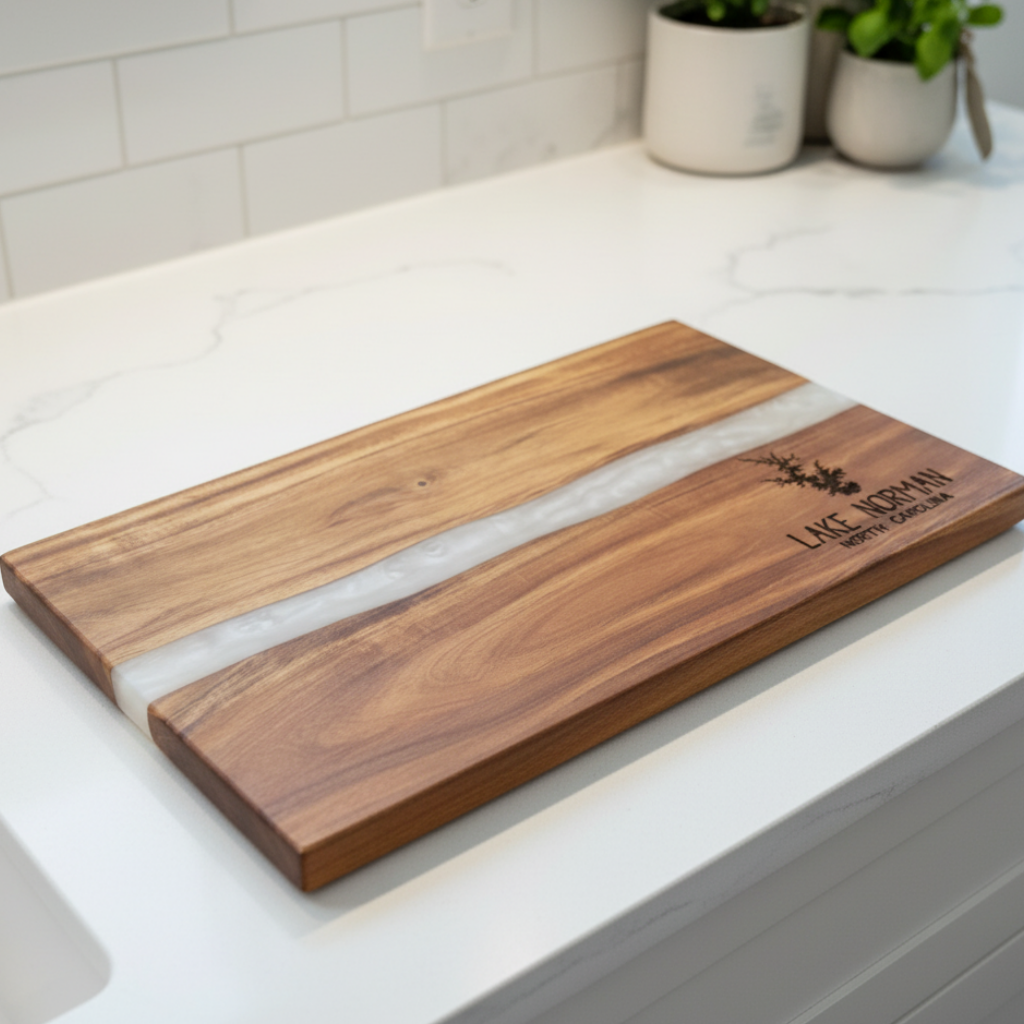 Wooden cutting board with white resin inlay on a kitchen counter