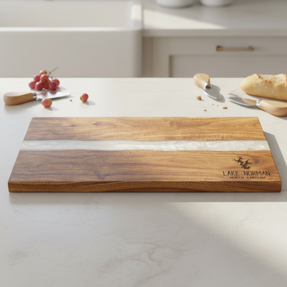 Wooden cutting board with white inlay on a kitchen counter