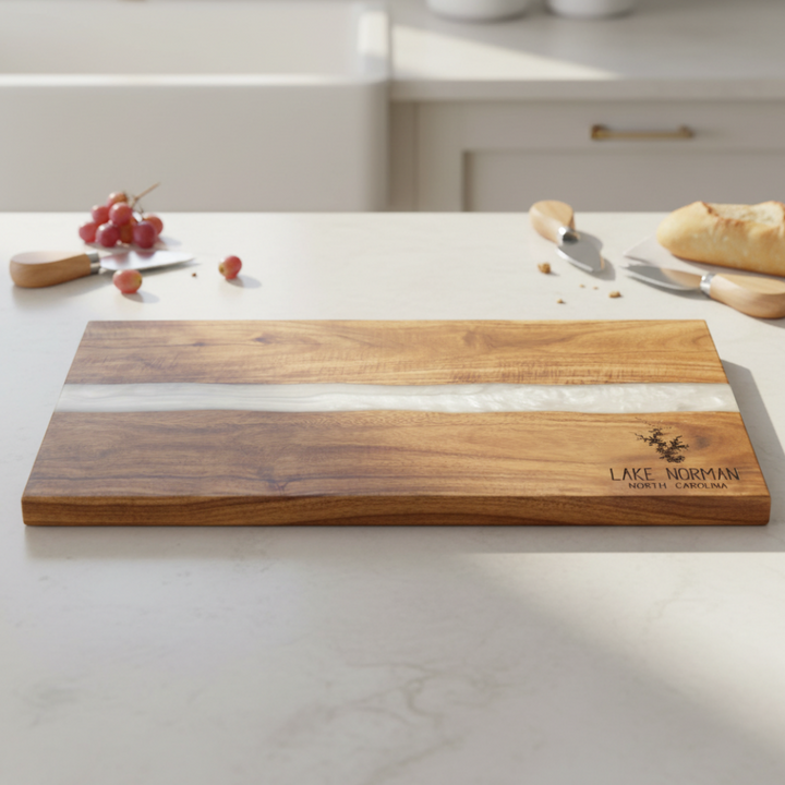 Wooden cutting board with white inlay on a kitchen counter