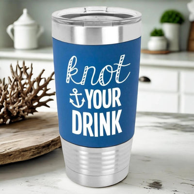 Royal blue 20 oz Polar Camel stainless steel tumbler with blue silicone sleeve laser engraved in white with the saying knot your drink. A fun nautical humor for boat lovers with the nautical spelling of k n o t.