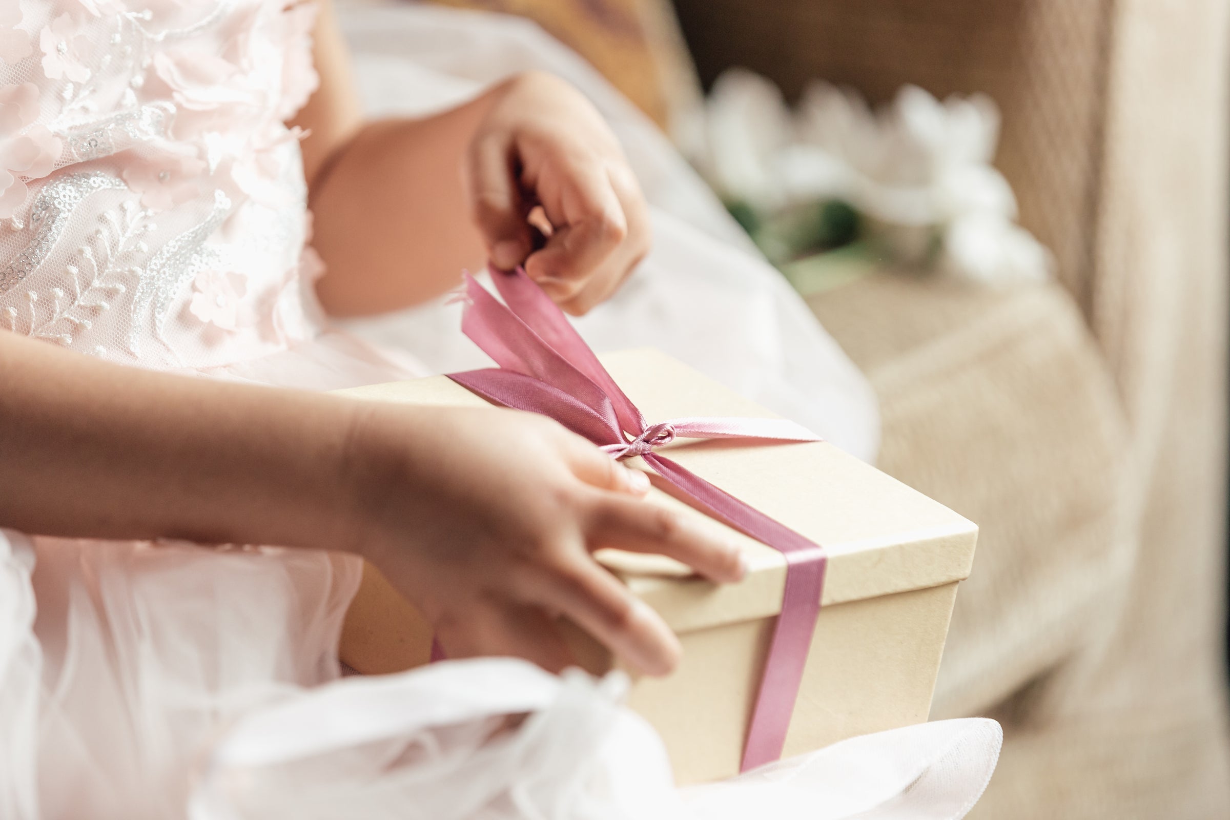 young girl opening gift box