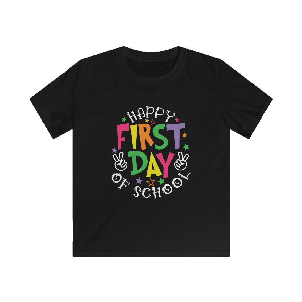 Black shirt with a cheerful message in lively rainbow colored letters, spelling out Happy First Day of School in pink, yellow, orange, green, and purple letters.