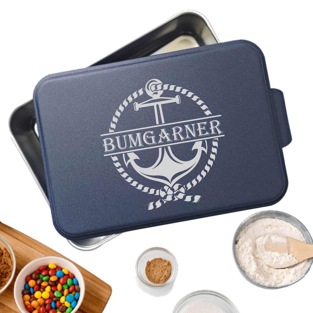 Metal cake pan with navy lid personalized with 'Bumgarner' monogram in the middle with a nautical rope and anchor around name.