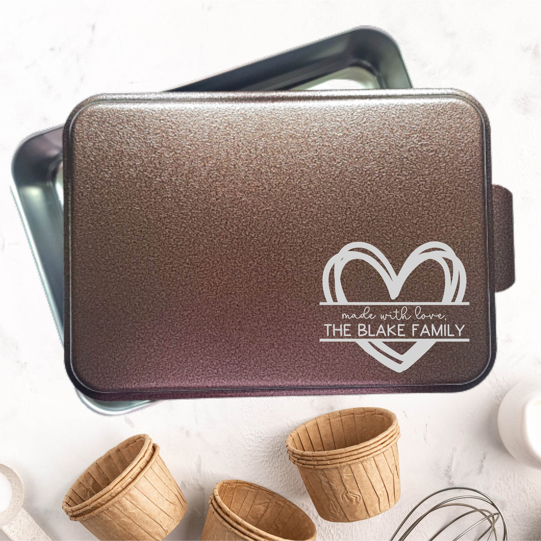 Baking pan with copper lid personalized with 'Made with love, The Blake Family' engraved in bottom right corner.