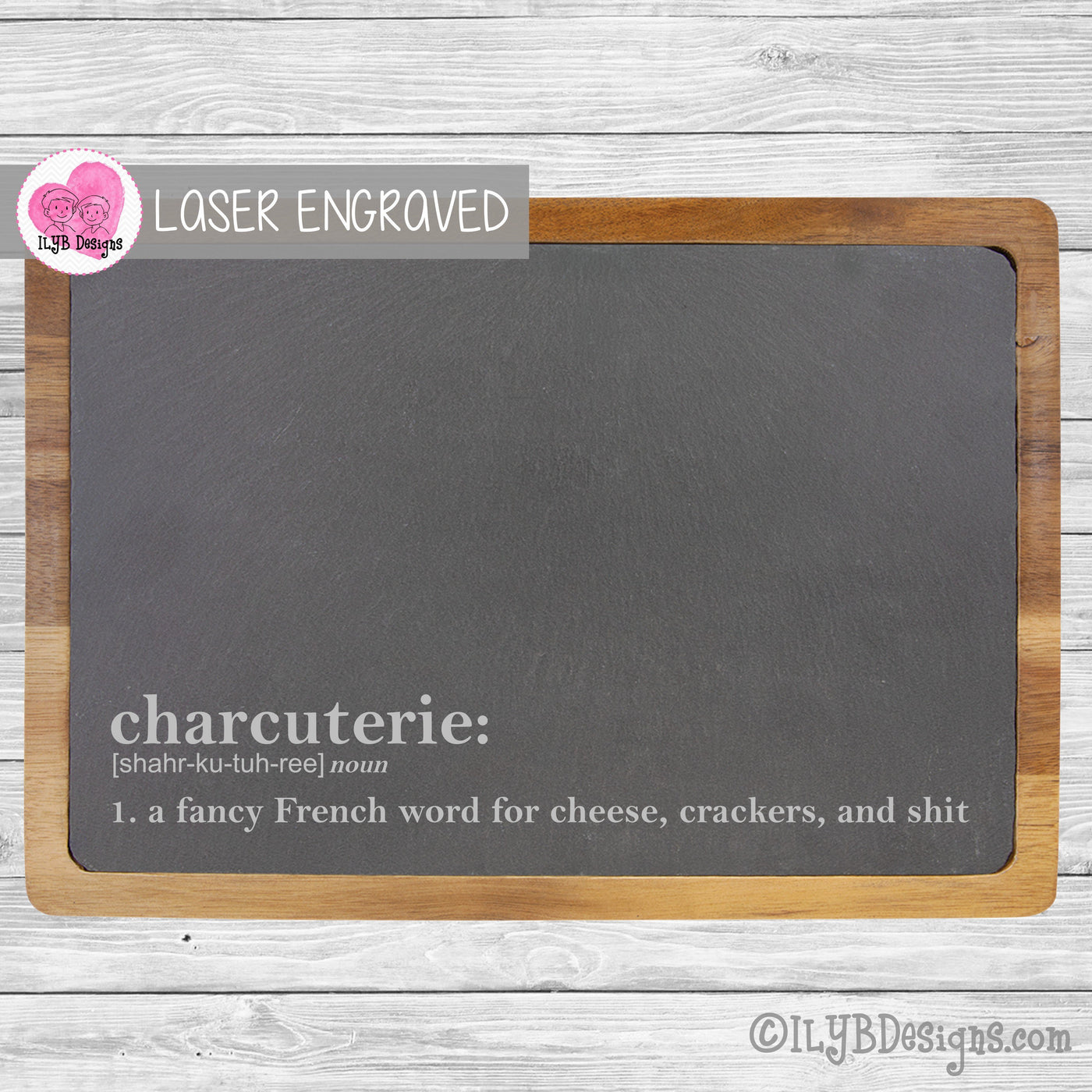 13"x9" rectangle solid acacia wood with slate insert cutting or cheese board. It is custom laser engraved with the funny definition of the word charcuterie. Written like a dictionary definition, it reads, "a fancy French word for cheese, crackers, and shit."