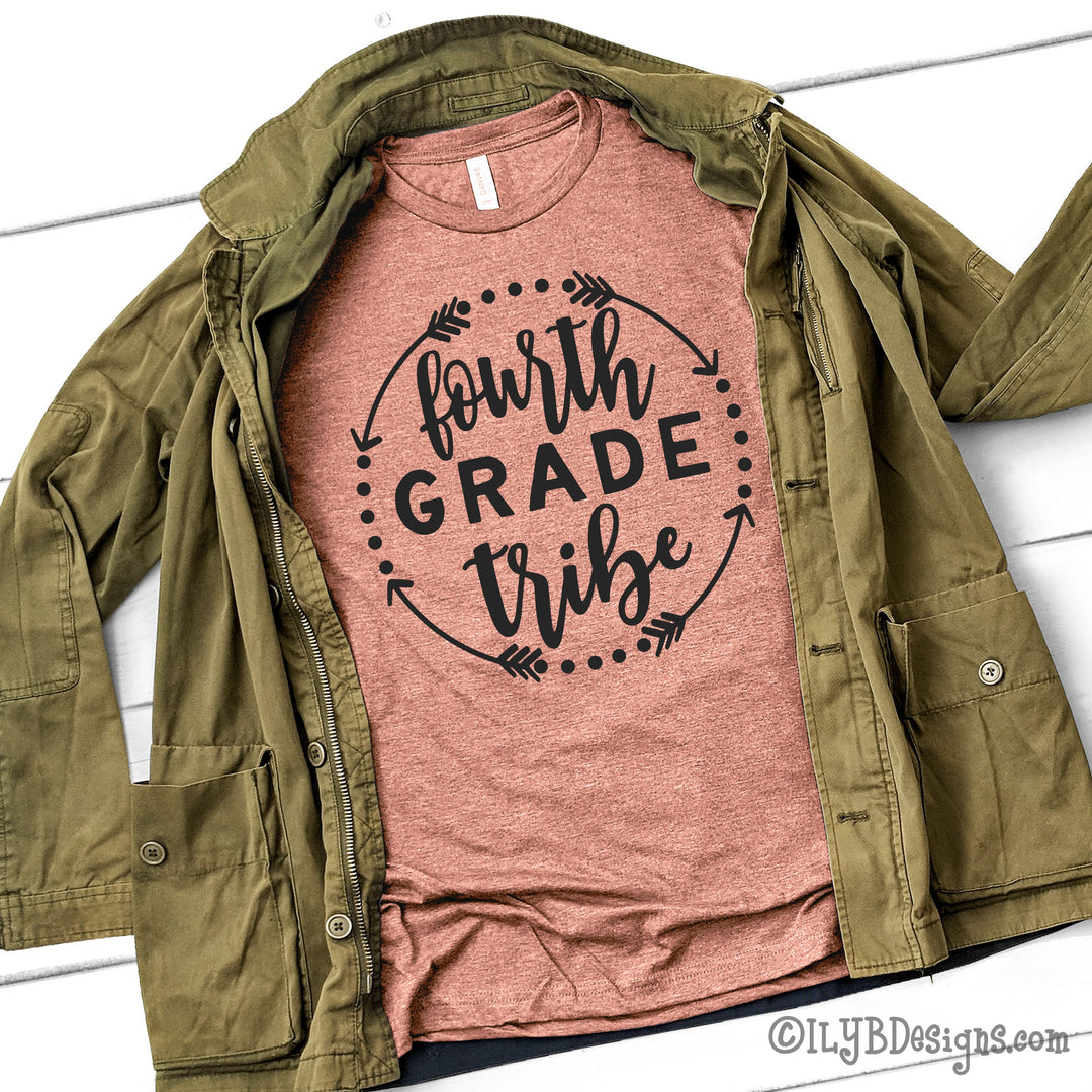 Heather prism sunset teaching tribe team teacher shirt featuring a black design with a circle motif and the words fourth grade tribe in a mix of print and script fonts.