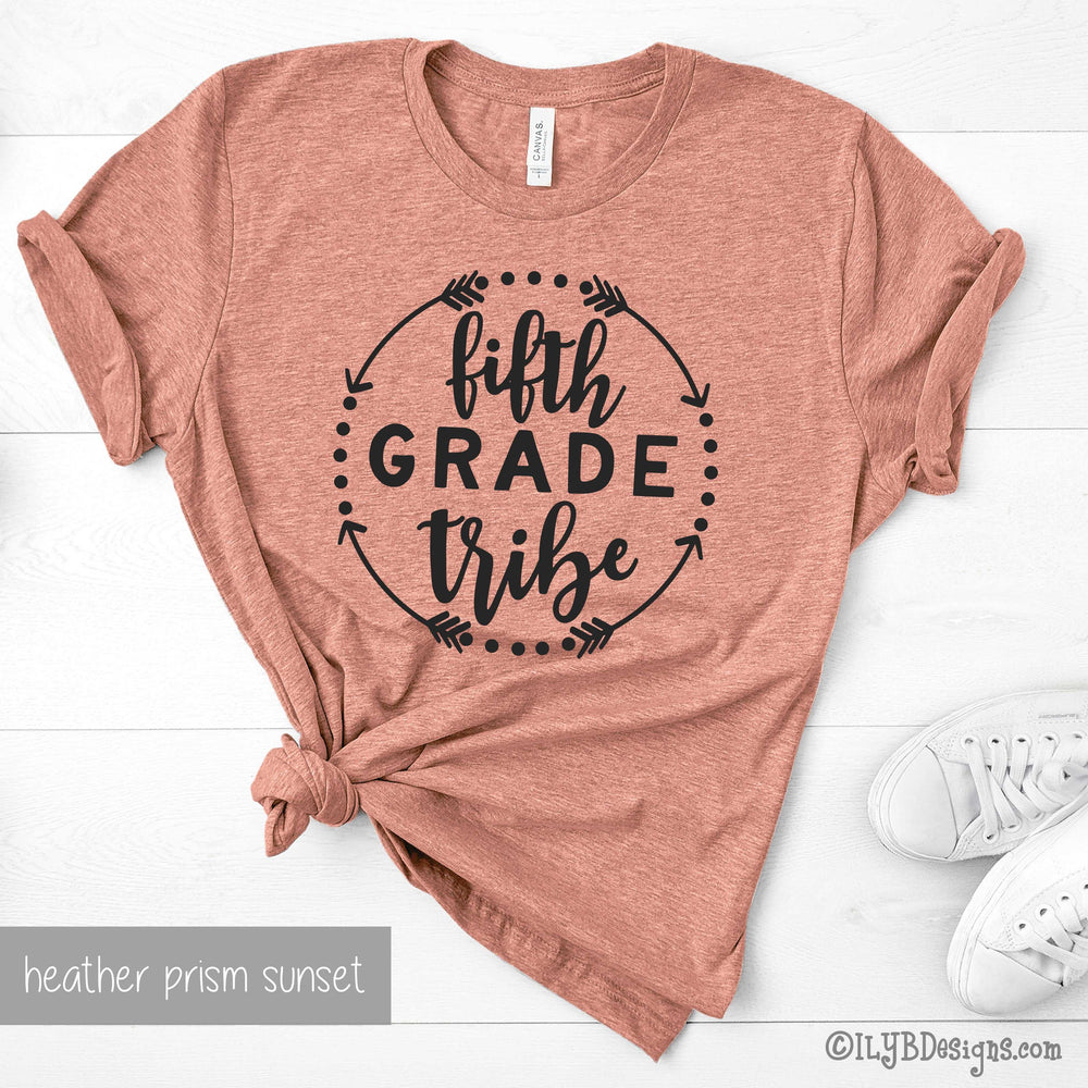 Heather prism sunset teaching tribe team teacher shirt featuring a black design with a circle motif and the words fourth grade tribe in a mix of print and script fonts.