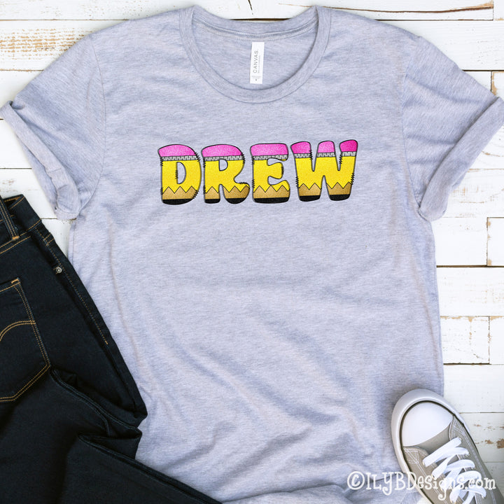 Youth athletic heather gray personalized name shirt for back to school with doodle letters that resemble school pencils to spell out your childs name.