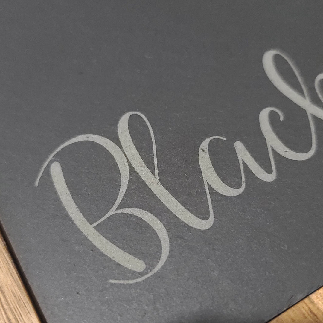 close up of engraved name on slate